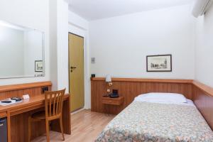 Posteľ alebo postele v izbe v ubytovaní Hotel San Marco
