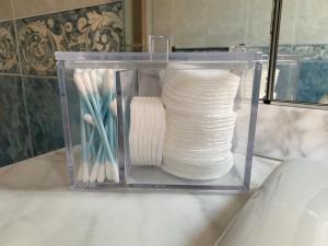 a plastic container filled with white yarn on a counter at Appartement Auber in Nice