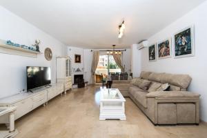 A television and/or entertainment centre at NEW ROYAL TORREQUEBRADA BEACH ideal for families & groups