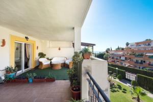 A balcony or terrace at NEW ROYAL TORREQUEBRADA BEACH ideal for families & groups