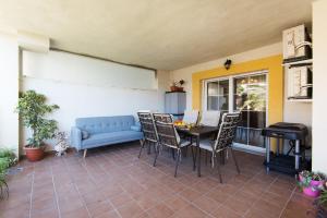 A seating area at NEW ROYAL TORREQUEBRADA BEACH ideal for families & groups