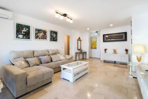 A seating area at NEW ROYAL TORREQUEBRADA BEACH ideal for families & groups