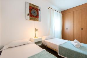 A bed or beds in a room at NEW ROYAL TORREQUEBRADA BEACH ideal for families & groups