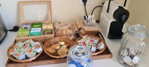 a counter top with baskets of food and a jar at Appartement deux chambres - Garibaldi in Lyon