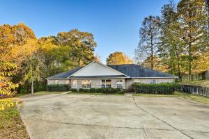 a house with a driveway in front of it at Auburn Home with Private Yard Less Than 4 Mi to Campus! in Auburn