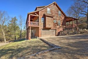 a large wooden house with a large garage at Family-Friendly Cabin By Golf Course and Marina in Holiday Island