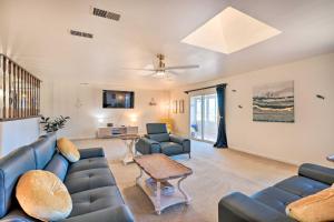 a living room with a couch and a table at That 70s House with Deck and Arroyo Grande View in Arroyo Grande