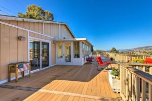 a wooden deck with a house and a bench at Retro House with Deck and Arroyo Grande View in Arroyo Grande