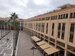 an empty street in front of a building at Apartamento Ejido Centro in El Ejido