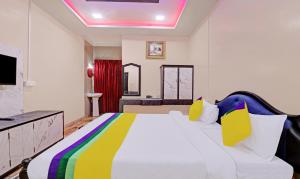 Postel nebo postele na pokoji v ubytování Itsy Hotels Hill Town, 500 Mtrs From Madikeri Fort + 18 fotografií