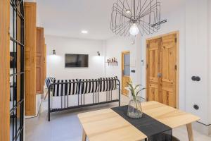 Postel nebo postele na pokoji v ubytování Piso-Loft COS Jaén Centro