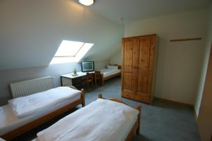 Postel nebo postele na pokoji v ubytování Hotel Restaurant Tychon AG