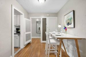 a kitchen and dining room with a table and chairs at Step Back in Time Historic Details Ideal Location in Oklahoma City