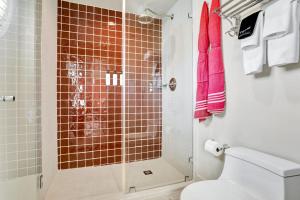 a bathroom with a shower with a toilet at Hotel Trouvail Miami Beach in Miami Beach