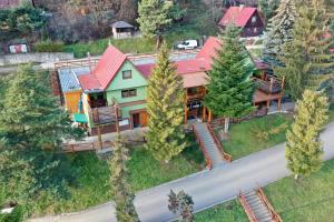 an aerial view of a house with a red roof at Ride Pub Drienica in Drienica