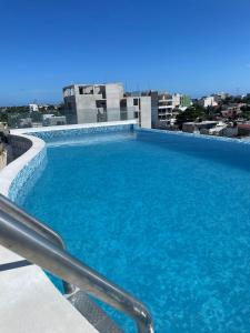 a large swimming pool on top of a building at WINDAY HOTEL - Cerca 5a Avenida in Playa del Carmen