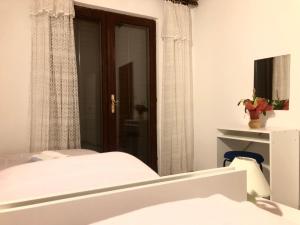 Postel nebo postele na pokoji v ubytování Nar Apartment