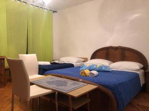 Postel nebo postele na pokoji v ubytování Nar Apartment