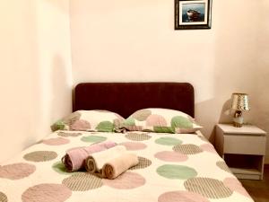 Postel nebo postele na pokoji v ubytování Nar Apartment