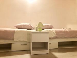 Postel nebo postele na pokoji v ubytování Nar Apartment