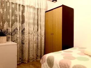 Postel nebo postele na pokoji v ubytování Nar Apartment