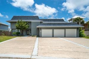 a house with two garage doors in a driveway at Edgewater Escape in Rockport