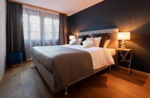 Postel nebo postele na pokoji v ubytování The Blue Ice Apartment - GRINDELHOMES
