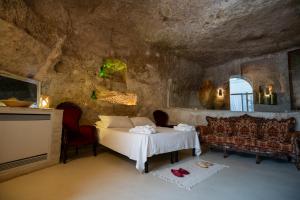 Ένα ή περισσότερα κρεβάτια σε δωμάτιο στο Albergo Diffuso Il Casale