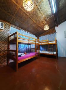 Postel nebo postele na pokoji v ubytování Paraiso Hostel Moalboal
