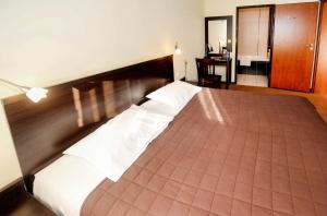 Postel nebo postele na pokoji v ubytování Hotel Liburnia