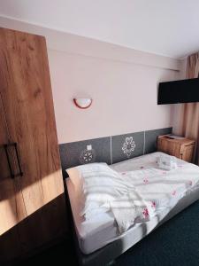 Postel nebo postele na pokoji v ubytování Ośrodek Wypoczynkowy Start