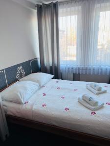 Postel nebo postele na pokoji v ubytování Ośrodek Wypoczynkowy Start