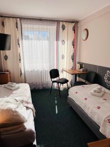 Postel nebo postele na pokoji v ubytování Ośrodek Wypoczynkowy Start