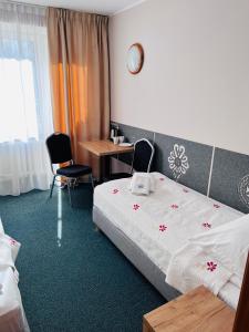 Postel nebo postele na pokoji v ubytování Ośrodek Wypoczynkowy Start