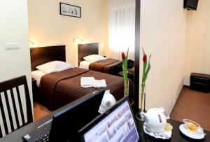 Postel nebo postele na pokoji v ubytování Hotel Liburnia