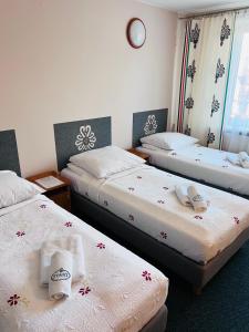 Postel nebo postele na pokoji v ubytování Ośrodek Wypoczynkowy Start