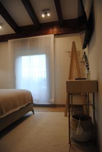 A bed or beds in a room at Hotel a Ecogranxa
