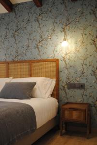 A bed or beds in a room at Hotel a Ecogranxa