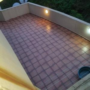 a tiled floor on a balcony at night at Imanna 111 in Durban