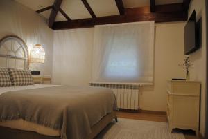 A bed or beds in a room at Hotel a Ecogranxa