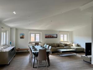 a living room with a couch and a table at Aromatik apartments in Girona