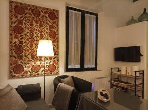 TV a/nebo společenská místnost v ubytování Encantador apartamento en el Centro