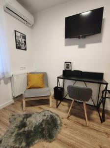 a living room with a desk and a chair at LaRoom - Free Parking in Zagreb