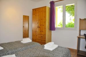 Ένα ή περισσότερα κρεβάτια σε δωμάτιο στο Charmante villa en Provence