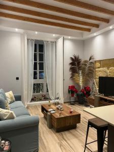 Posezení v ubytování Nabrisa apartamento moderno en pleno centro con opción a parking