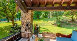 an outdoor patio with a wooden pergola at Caserío Mahasti in Butrón