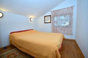 Postel nebo postele na pokoji v ubytování Apartments Jasminka