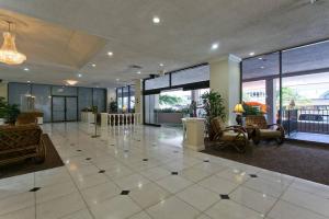 a lobby with a large room with chairs and tables at Royal Kuhio 2309 - Spacious Studio with Stunning Ocean Views in the Heart of Waikiki! in Honolulu +33 photos