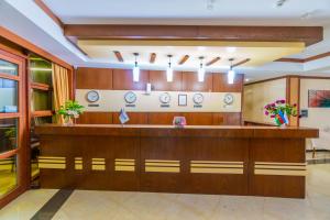 a lobby with a reception desk in a building at Ladera Resort Qusar in Qusar