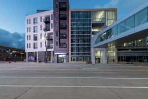 an empty parking lot in front of a building at Flexhome Skywalk to Fiserv 1BR Apt U7 - READ INFO in Milwaukee